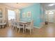 Elegant dining room with a large table and modern chandelier fixture at 2985 Buccaneer Palm Rd, Kissimmee, FL 34747