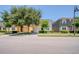 Street view showcasing well-maintained homes and landscaping in the neighborhood at 2985 Buccaneer Palm Rd, Kissimmee, FL 34747