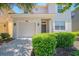 Charming home featuring an attached garage and well-manicured front yard at 2985 Buccaneer Palm Rd, Kissimmee, FL 34747