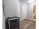 Hallway featuring a beverage cooler and access to the bathroom and closet at 2985 Buccaneer Palm Rd, Kissimmee, FL 34747