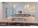Granite countertops highlight a sink overlooking a living room in this modern kitchen at 2985 Buccaneer Palm Rd, Kissimmee, FL 34747