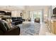 Bright and spacious living area with sliding glass doors and stylish furniture at 2985 Buccaneer Palm Rd, Kissimmee, FL 34747