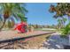 Community playground with a slide and play area surrounded by lush landscaping at 2985 Buccaneer Palm Rd, Kissimmee, FL 34747