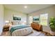 Cozy bedroom showcasing natural light, wood floors, and a dresser for ample storage at 3063 Sw 168Th Loop, Ocala, FL 34473