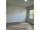 A bright bedroom features new floors and one window at 3063 Sw 168Th Loop, Ocala, FL 34473