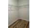 An empty closet with wire shelving and wood-look flooring at 3063 Sw 168Th Loop, Ocala, FL 34473