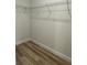 An empty closet with wire shelving and wood-look flooring at 3063 Sw 168Th Loop, Ocala, FL 34473