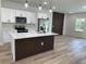 Modern kitchen featuring white cabinets, stainless appliances, and a center island at 3063 Sw 168Th Loop, Ocala, FL 34473