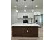 Modern kitchen featuring white cabinets, stainless appliances, and a center island at 3063 Sw 168Th Loop, Ocala, FL 34473