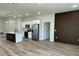 Open-concept kitchen with stainless steel appliances and an eat-in center island at 3063 Sw 168Th Loop, Ocala, FL 34473