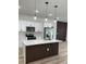 Modern kitchen featuring white cabinets, stainless appliances, and a center island at 3063 Sw 168Th Loop, Ocala, FL 34473