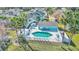 Aerial view showcases the community pool, hot tub, and surrounding condos at 3157 Britannia Blvd # B, Kissimmee, FL 34747