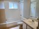 Bathroom featuring a shower over bath and basin with mirror at 3157 Britannia Blvd # B, Kissimmee, FL 34747