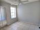 Bedroom featuring a window and sliding door mirrored closet doors at 3157 Britannia Blvd # B, Kissimmee, FL 34747