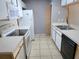 Bright kitchen with white appliances, laminate countertops and lots of storage space at 3157 Britannia Blvd # B, Kissimmee, FL 34747