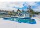 Community pool and hot tub is surrounded by lounge chairs and a white fence at 3157 Britannia Blvd # B, Kissimmee, FL 34747