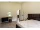 Bright bedroom showcasing a double bed, natural light and a vanity at 346 Bowfin Ct, Kissimmee, FL 34759
