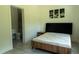Bedroom with sleek bed, stylish decor, and an en suite bathroom at 346 Bowfin Ct, Kissimmee, FL 34759