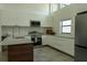 Bright kitchen with white cabinets, stainless steel appliances, and a kitchen island at 346 Bowfin Ct, Kissimmee, FL 34759
