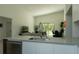 Kitchen island with stainless steel sink overlooking the living and dining area at 346 Bowfin Ct, Kissimmee, FL 34759