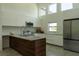 Modern kitchen featuring a kitchen island, stainless steel appliances and plentiful natural light at 346 Bowfin Ct, Kissimmee, FL 34759