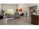 Bright and spacious living room featuring a modern design with tile floors and an open floor plan at 346 Bowfin Ct, Kissimmee, FL 34759