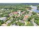 A home is nestled in a beautiful neighborhood with mature trees at 356 N Spaulding Cv, Lake Mary, FL 32746