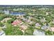 A wide aerial shot showing a lush and verdant neighborhood with many lakes at 356 N Spaulding Cv, Lake Mary, FL 32746
