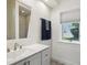 Bathroom featuring vanity, sink and shower with views of the outdoors at 356 N Spaulding Cv, Lake Mary, FL 32746