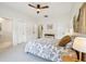 Bright, modern bedroom with neutral décor and a ceiling fan, plus ensuite bathroom access at 356 N Spaulding Cv, Lake Mary, FL 32746