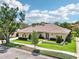 Charming one-story home with a well-maintained lawn, mature trees, and an inviting entrance at 356 N Spaulding Cv, Lake Mary, FL 32746