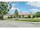 Inviting one-story home featuring manicured landscaping, a tile roof, and attached garage at 356 N Spaulding Cv, Lake Mary, FL 32746