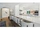 Bright kitchen featuring hardwood floors, an island with seating, and stainless steel appliances at 356 N Spaulding Cv, Lake Mary, FL 32746
