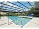 Inviting screened-in pool with ample seating, a hot tub, and a clean, modern design at 356 N Spaulding Cv, Lake Mary, FL 32746