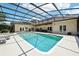 A screened-in pool with lounge chairs offers a refreshing oasis at this beautiful home at 356 N Spaulding Cv, Lake Mary, FL 32746