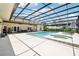 Large screened-in pool area with spa and outdoor seating; an ideal space for relaxation and enjoyment at 356 N Spaulding Cv, Lake Mary, FL 32746