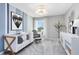 Comfortable Bedroom with soft decor, a cozy crib and a reading chair at 3610 Raindrop Way, Sanford, FL 32773