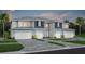 Charming townhome with manicured lawn, private driveways, and appealing two-story facade at 3610 Raindrop Way, Sanford, FL 32773