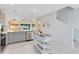 Bright kitchen features stainless steel appliances, gray cabinetry, and open floor plan at 3610 Raindrop Way, Sanford, FL 32773