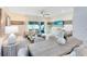 Bright living and dining area with sliding door, neutral decor and modern finishes at 3610 Raindrop Way, Sanford, FL 32773