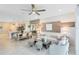 Open-concept living and dining area with modern furnishings and decor at 3610 Raindrop Way, Sanford, FL 32773