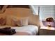 Comfortable bedroom with a white canopy bed, plush pillows, and soft lighting at 3880 Sonoma Blvd, Kissimmee, FL 34741