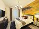 Bedroom with king bed, flat screen TV, decorative mural and a stylish chandelier for added appeal at 3880 Sonoma Blvd, Kissimmee, FL 34741