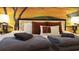 Bedroom featuring a king bed with accent pillows, warm lighting, and a colorful nature themed wall mural at 3880 Sonoma Blvd, Kissimmee, FL 34741