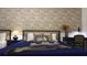 Cozy bedroom featuring twin beds, decorative wallpaper, and warm lighting at 3880 Sonoma Blvd, Kissimmee, FL 34741