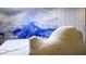 Relaxing bedroom with comfortable seating and a captivating mountain mural, creating a serene escape at 3880 Sonoma Blvd, Kissimmee, FL 34741