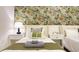 Charming bedroom with floral wallpaper, two twin beds, and stylish nightstands at 3880 Sonoma Blvd, Kissimmee, FL 34741