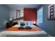 A cozy bedroom with stylish wall decor and a comfortable bed at 3880 Sonoma Blvd, Kissimmee, FL 34741