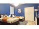 Stylish bedroom featuring two twin beds, Mickey art, and patterned rug at 3880 Sonoma Blvd, Kissimmee, FL 34741