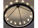 Modern circle chandelier features several warm toned Edison bulbs at 3880 Sonoma Blvd, Kissimmee, FL 34741